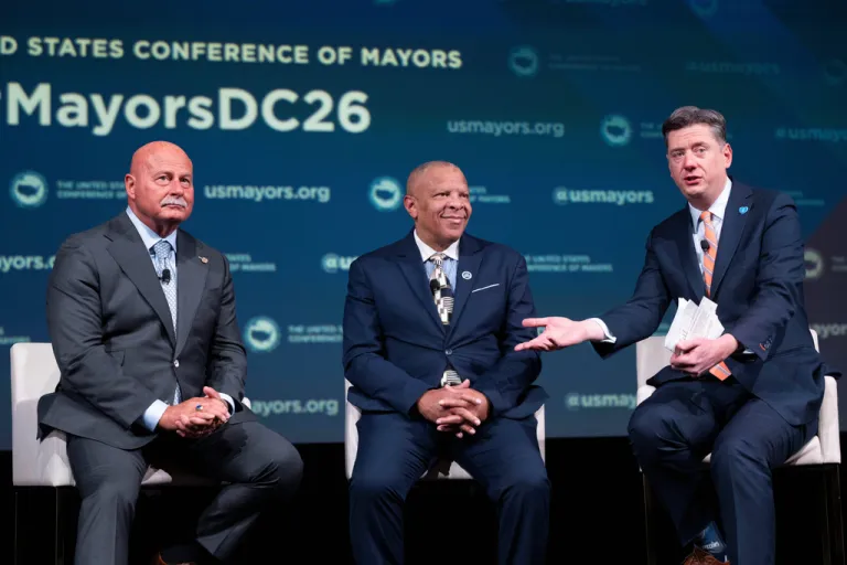 Oklahoma City Mayor David Holt, right, speaks during a panel discussion with Fresno, California, Mayor Jerry Dyer, left, and Omaha, Nebraska, Mayor John Ewing, Jr. during the 94th Winter Meeting of the U.S. Conference of Mayors.