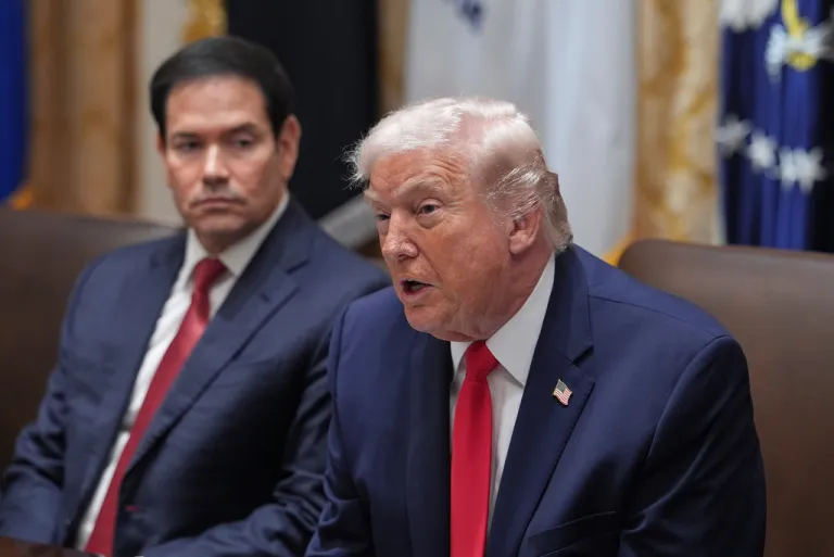 President Donald Trump speaks as Secretary of State Marco Rubio listens during a cabinet meeting at the White House