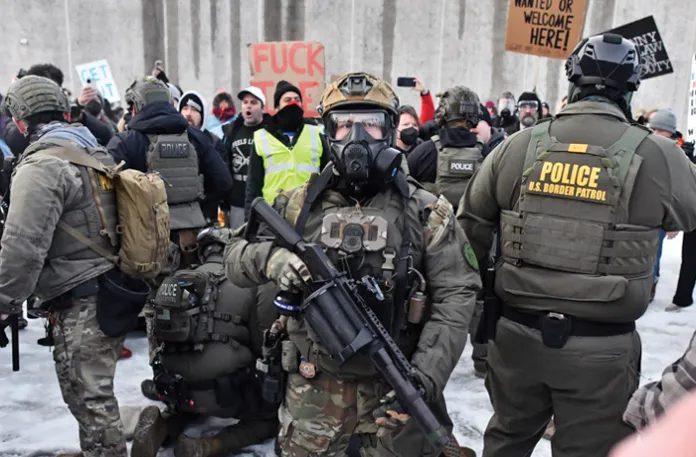 Protestors clash with federal agents outside the Bishop Henry Whipple Federal Building in Saint Paul, Minnesota, on January 8, 2026. (Octavio Jones/Getty)