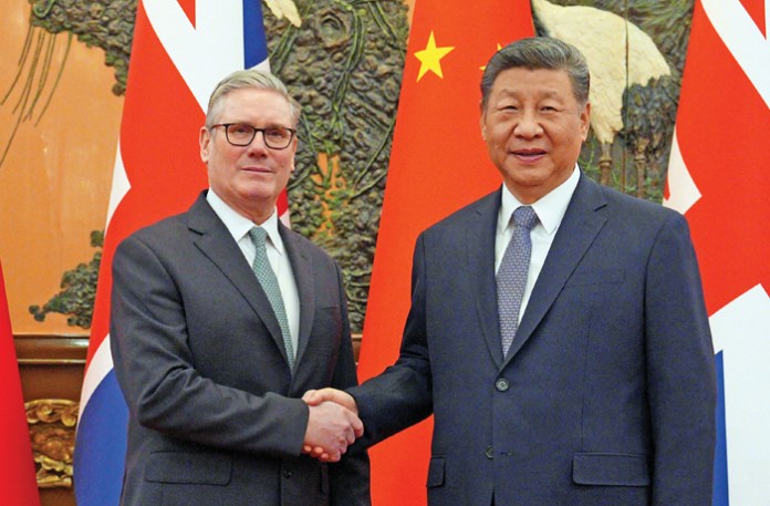 British Prime Minister Keir Starmer, left, meets with Chinese President Xi Jinping in Beijing, Jan. 29, 2026.  (Carl Court/AP)