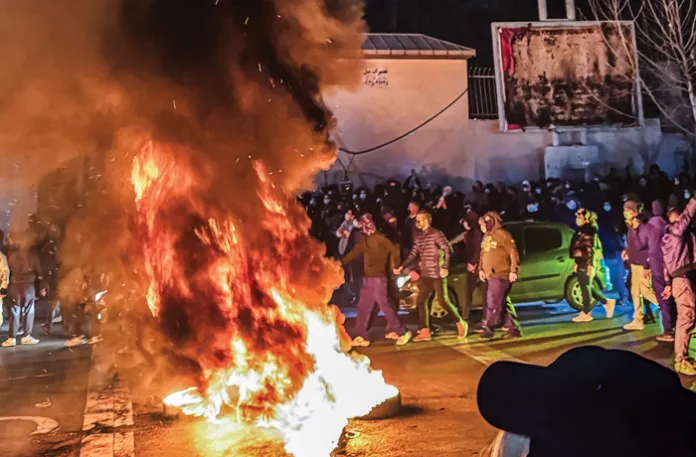 Iranians gather while blocking a street during a protest in Tehran, Iran on Jan. 9, 2026. (MAHSA/Middle East Images/AFP via Getty Images)
