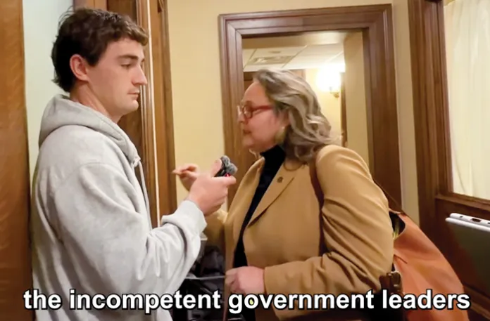 Shirley questions Minnesota Democratic state Rep. Emma Greenman in the state Capitol building after a hearing in which Greenman decried the attention being paid to the alleged fraud and insisted that it is not a partisan issue. (Nick Shirley/YouTube)