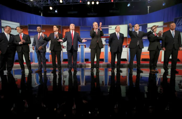 Republican presidential candidates from left: Chris Christie, Marco Rubio, Ben Carson, Scott Walker, Donald Trump, Jeb Bush, Mike Huckabee, Ted Cruz, Rand Paul, and John Kasich take the stage for the first Republican presidential debate in Cleveland, Ohio, on Aug. 6, 2015. (Andrew Harnik/AP)