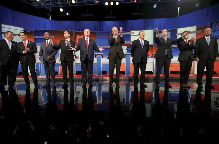 Republican presidential candidates from left: Chris Christie, Marco Rubio, Ben Carson, Scott Walker, Donald Trump, Jeb Bush, Mike Huckabee, Ted Cruz, Rand Paul, and John Kasich take the stage for the first Republican presidential debate in Cleveland, Ohio, on Aug. 6, 2015. (Andrew Harnik/AP)