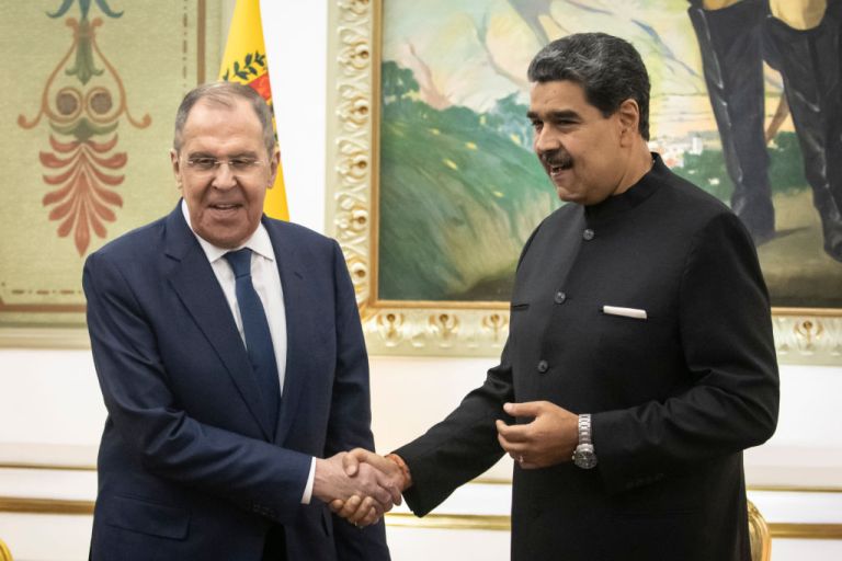 Nicolas Maduro, Venezuela's president, right, shakes hands with Sergei Lavrov, Russia's foreign minister, during a meeting at Miraflores Palace in Caracas, Venezuela, on Tuesday, Feb. 20, 2024. Russia and Venezuela agreed to broaden their oil production cooperation, Russia's Lavrov said from Caracas. Photographer: Carlos Becerra/Bloomberg via Getty Images Photographer: Carlos Becerra/Bloomberg via Getty Images