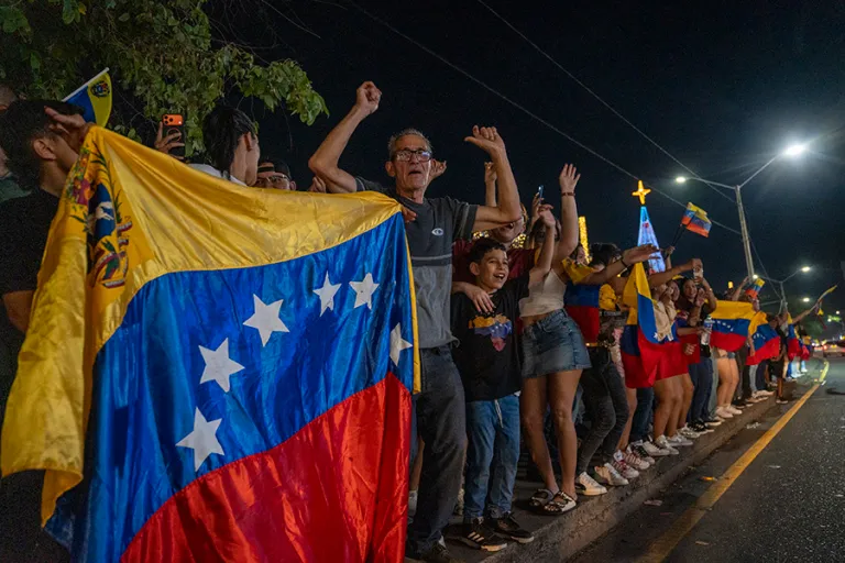 Venezuelan citizens celebrate during a rally on the Colombia-Venezuela border after the confirmation of Nicolas Maduro's capture this early morning in Caracas, on January 3, 2026 in Cucuta, Colombia. President Donald Trump announced that Nicolas Maduro and his wife, Cilia Flores, were captured in the early morning in Caracas after a military operation led by the Delta Force, the elite special missions unit of the U.S. military. (Photo by Jair F. Coll/Getty Images)