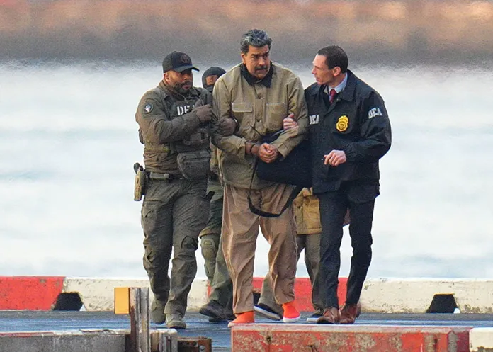 Nicolas Maduro is seen in handcuffs after landing at a Manhattan helipad, escorted by heavily armed Federal agents as they make their way into an armored car en route to a Federal courthouse in Manhattan on January 5, 2026 in New York City. (Photo by XNY/Star Max/GC Images)