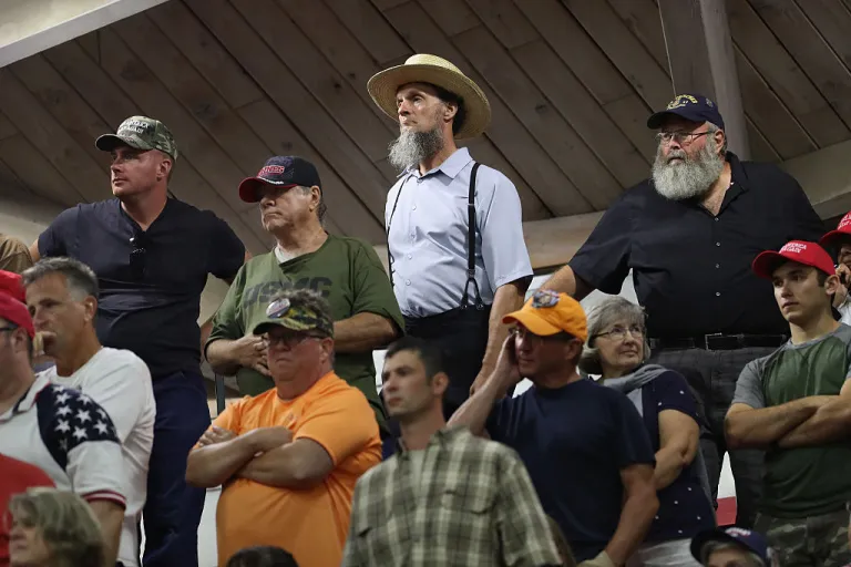 Supporters listen as Republican Presidential nominee Donald Trump speaks at a campaign rally on August 1, 2016 in Mechanicsburg, Pennsylvania. Trump spoke to some 5,000 people at the Cumberland Valley High School in eastern Pennsylvania on the last day of his campaign swing through 