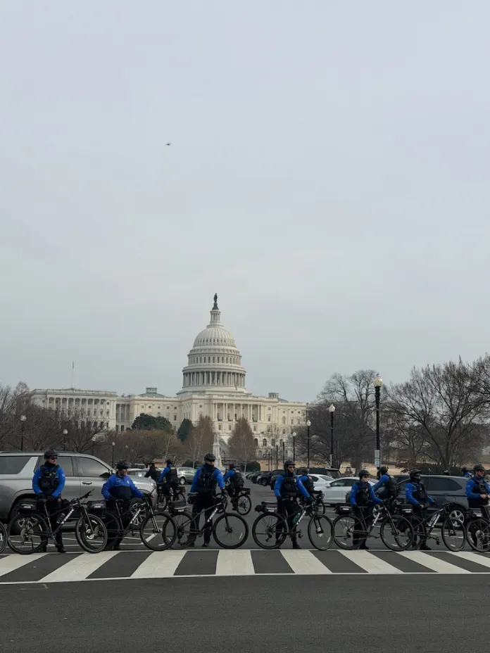Capitol police line up outside of the U.S Capitol building as January 6 defendants and families peacefully approach. (Sydney Topf/Washington Examiner)