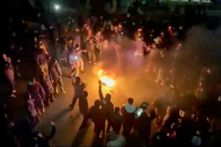 FILE - This frame grab from footage circulating on social media shows protesters dancing and cheering around a bonfire as they take to the streets despite an intensifying crackdown as the Islamic Republic remains cut off from the rest of the world, in Tehran, Iran, Jan. 9, 2026. (UGC via AP, File)