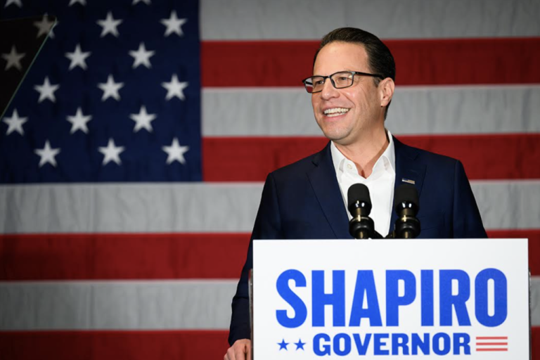 Josh Shapiro campaigning in Collier Township, PA with American flag as backdrop. (Justin Merriman / Washington Examiner)