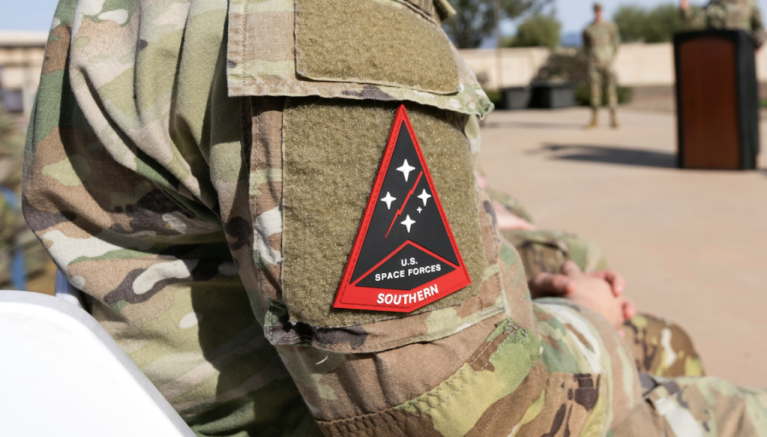 A U.S. Space Force Guardian attends an activation ceremony for Space Forces Southern at Davis-Monthan Air Force Base, Arizona, Jan. 21, 2026. SPACEFOR–SOUTH became operational effective Dec. 1, 2025, the ceremony formally recognized the activation with the assumption of command by Col. Brandon P. Alford, and the digital unveiling of the Space Forces Southern emblem, symbolizing the command’s mission and regional focus. (U.S. Air Force photo by Tech. Sgt. Rachel Maxwell)