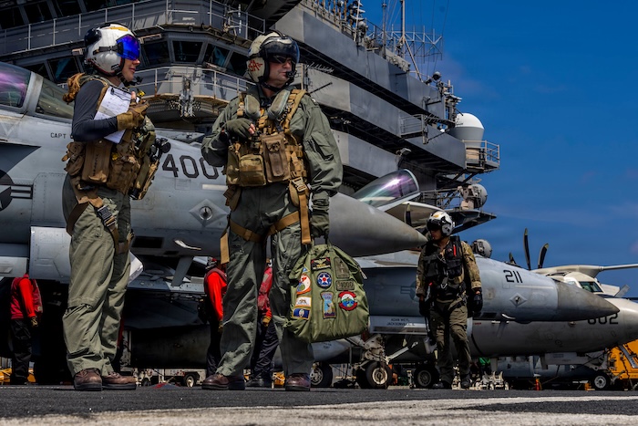 This handout image from the U.S. Navy shows Capt. Daniel Keeler, the commanding officer of the Nimitz-class aircraft carrier USS Abraham Lincoln, as he prepares to fly an MH-60R Sea Hawk helicopter in the Indian Ocean on Jan. 23, 2026. (Mass Communication Specialist Seaman Daniel Kimmelman/U.S. Navy via AP)