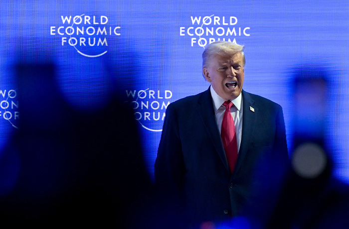 President Donald Trump walks on the stage during the 56th annual meeting of the World Economic Forum in Davos, Switzerland on Jan. 21. (Gian Ehrenzeller/Keystone via AP)