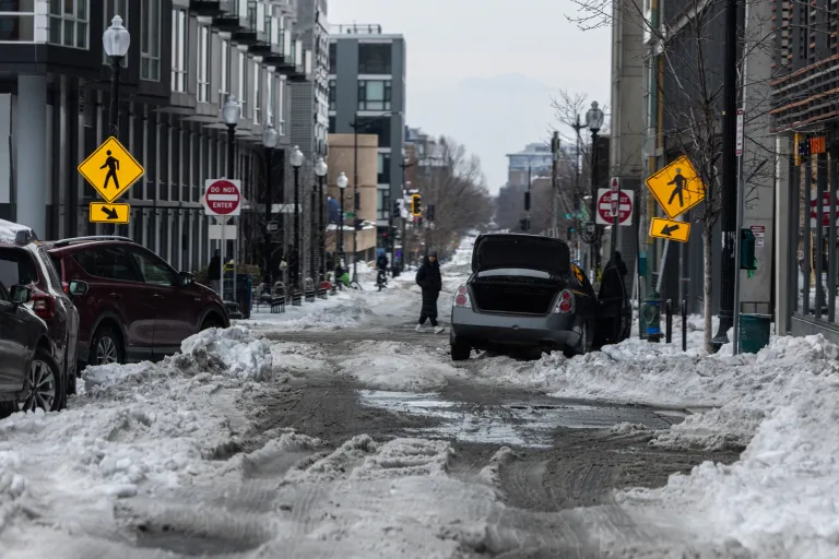 Washington, D.C., residents grapple with poor road conditions caused by a winter storm.
