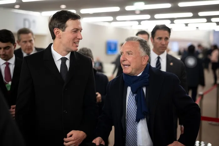 Jared Kushner, left, and Steve Witkoff walk in the corridors during the 56th annual meeting of the World Economic Forum, WEF, in Davos, Switzerland, Tuesday, Jan. 20, 2026. (Gian Ehrenzeller/Keystone via AP)