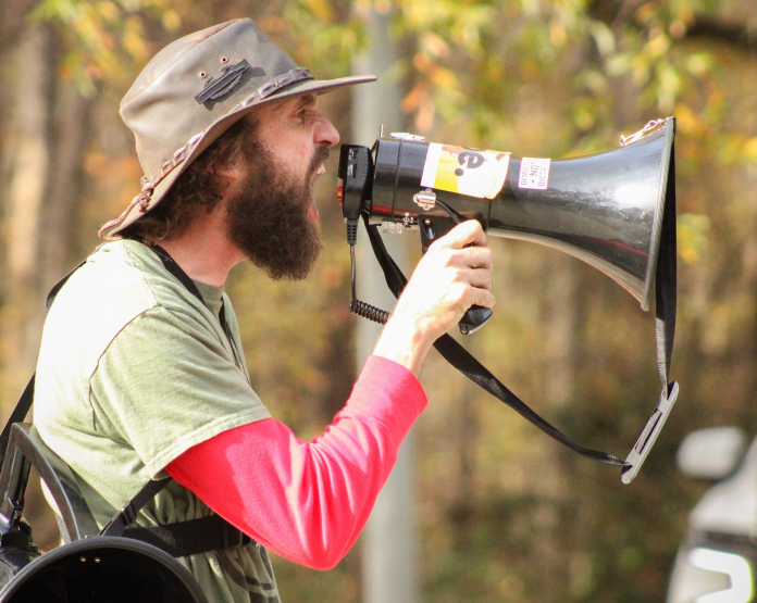 William Kelly with a megaphone