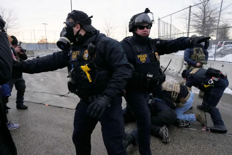 Police officers are seen during protests in Minneapolis.