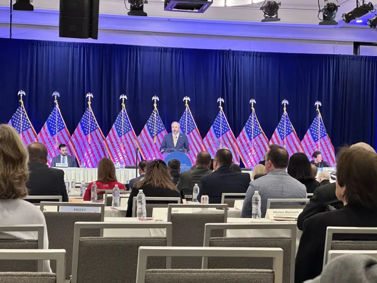 RNC Chairman Joe Gruters speaks at the RNC winter meeting with a line of American flags behind him in Santa Barbara, California, on Jan. 23, 2026. (Barnini Chakraborty/Washington Examiner)