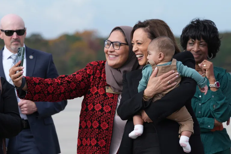 Kamala Harris poses for a photo with Nida Allam, chairwoman of the Durham County Board of Commissioners, and her son, Abdul Allam Aziz.