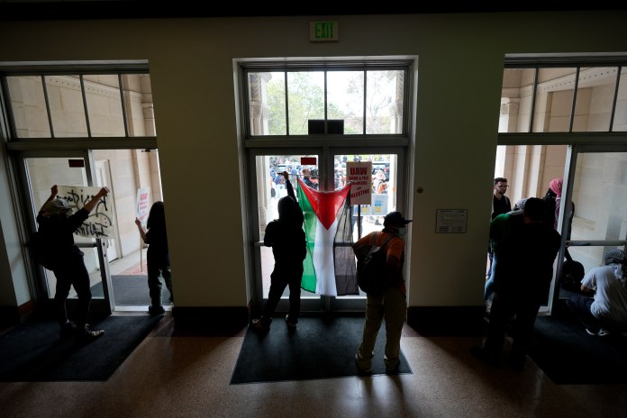 Pro-Palestinian demonstrators gather inside a building on the UCLA campus, May 23, 2024, in Los Angeles. (AP Photo/Ryan Sun, File)