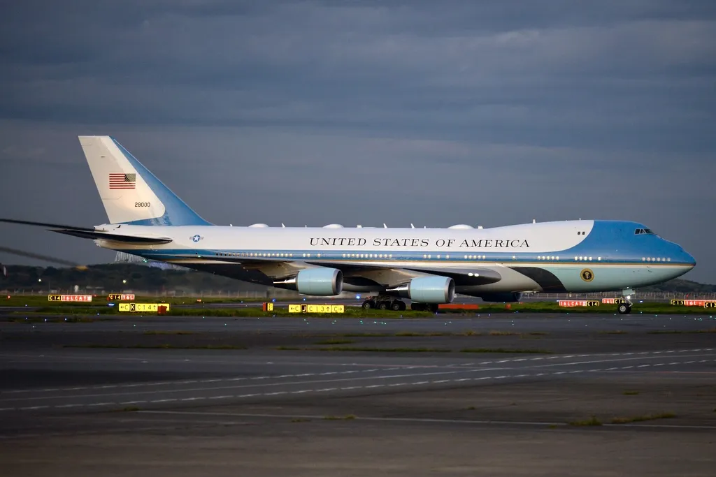 President Donald Trump arrives as Air Force One lands at Haneda Airport in Tokyo