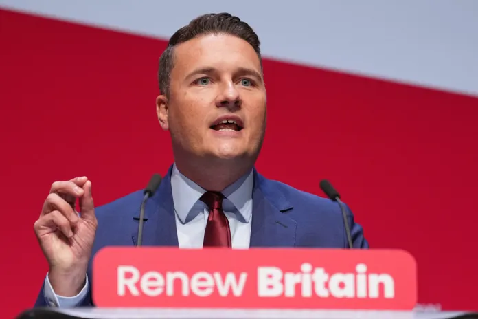 Wes Streeting speaks at a conference.