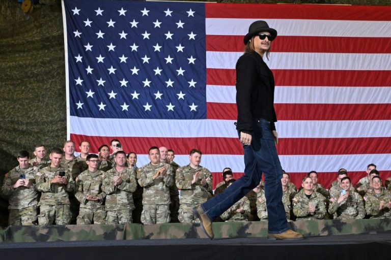Kid Rock walks onstage to speak and introduce Vice President JD Vance during a visit to Fort Campbell, Kentucky.