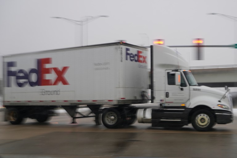 A FedEx truck makes deliveries in Buffalo Grove, Ill., Monday, Dec. 1, 2025. (AP Photo/Nam Y. Huh)