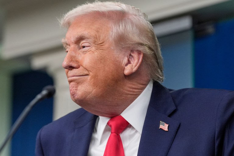 President Donald Trump smiles as he takes questions from reporters in the James Brady Press Briefing Room at the White House, Tuesday, Jan. 20, 2026, in Washington.