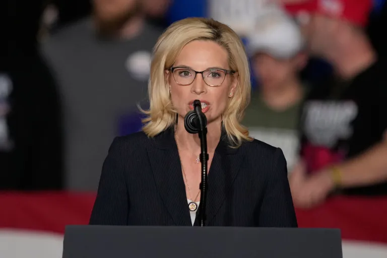 Rep. Ashley Hinson, R-Iowa, speaks before President Donald Trump arrives at a rally, Tuesday, Jan. 27, 2026, in Clive, Iowa. (AP Photo/Charlie Neibergall)
