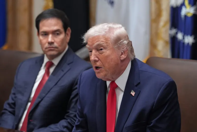 President Donald Trump speaks as Secretary of State Marco Rubio listens during a cabinet meeting at the White House, Thursday, Jan. 29, 2026, in Washington.