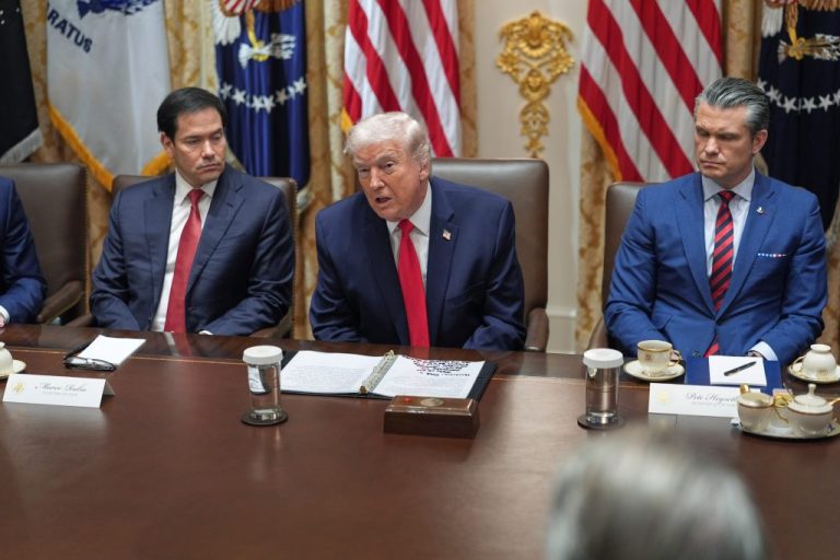 President Donald Trump speaks as Secretary of State Marco Rubio, left, and Defense Secretary Pete Hegseth listen during a cabinet meeting at the White House, Thursday, Jan. 29, 2026, in Washington.