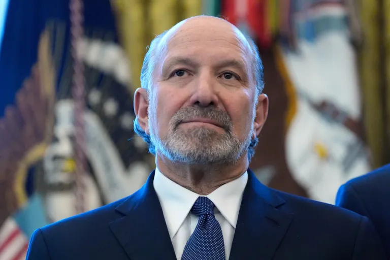 Commerce Secretary Howard Lutnick listens during an event with President Donald Trump in the Oval Office
