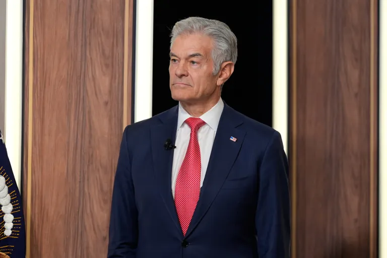 Centers for Medicare & Medicaid Services administrator Dr. Mehmet Oz listens as President Donald Trump speaks about TrumpRx in the South Court Auditorium in the Old Eisenhower Executive Office Building on the White House campus, Thursday, Feb. 5, 2026, in Washington.