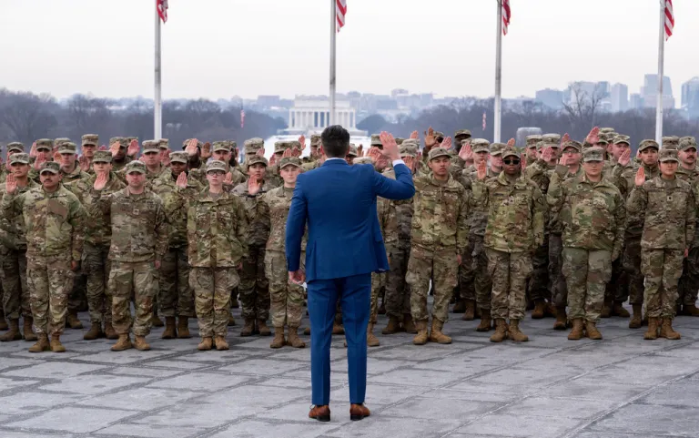 Defense Secretary Pete Hegseth administers the oath of enlistment to a group of National Guard soldiers, at the base of the Washington Monument, Friday, Feb. 6, 2026 in Washington. (AP Photo/Kevin Wolf)
