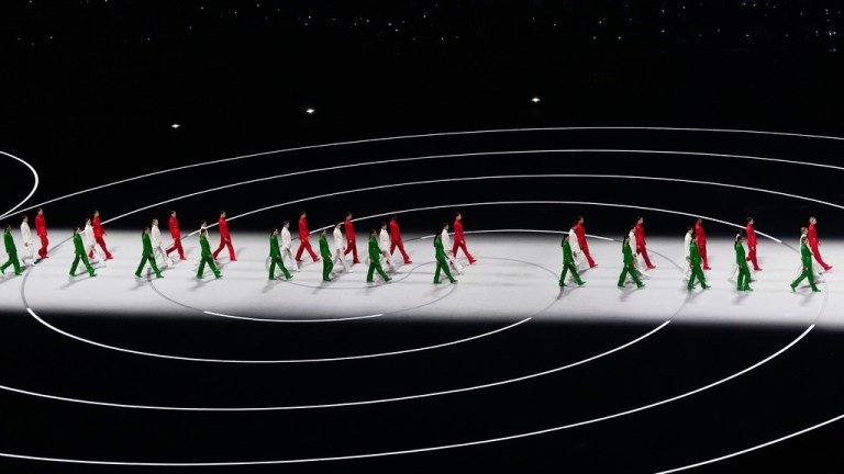 Artists wearing Italian colors perform during the Olympic opening ceremony at the 2026 Winter Olympics, in Milan, Italy, Friday, Feb. 6, 2026. (AP Photo/Petr David Josek)
