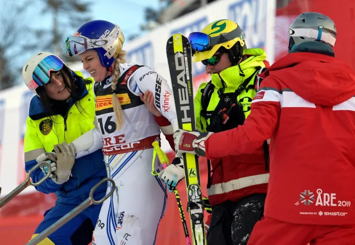 FILE - United States' Lindsey Vonn is assisted after crashing during the women's super G at the alpine ski World Championships