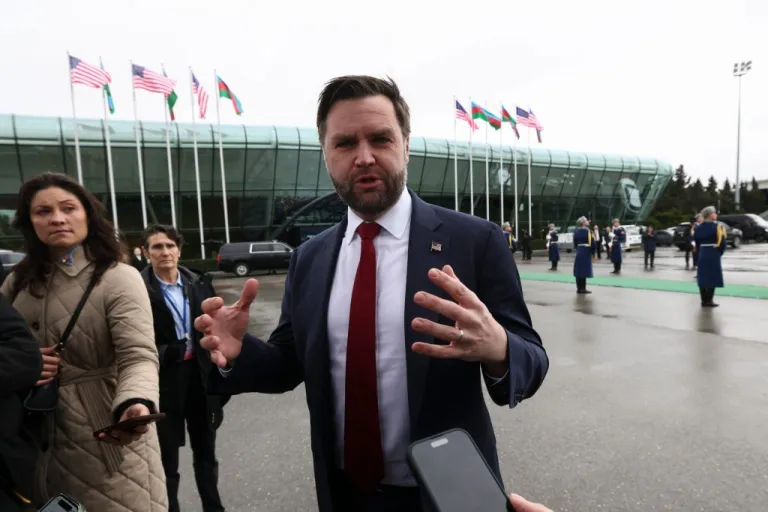 JD Vance speaks to the media before he boards Air Force Two to depart for Washington, in Baku, Azerbaijan Feb. 11, 2026.