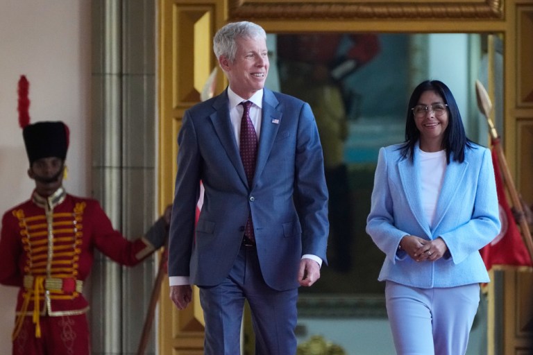 Venezuela's acting President Delcy Rodriguez and U.S. Energy Secretary Chris Wright walks after a meeting at Miraflores Palace in Caracas, Venezuela, Wednesday, Feb. 11, 2026. (AP Photo/Ariana Cubillos)
