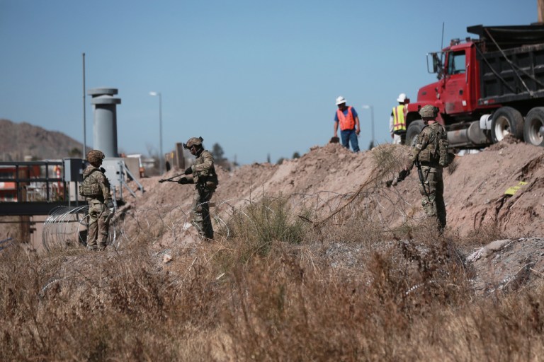 Security forces install barbed wire along the U.S. border in Ciudad Juarez, Mexico