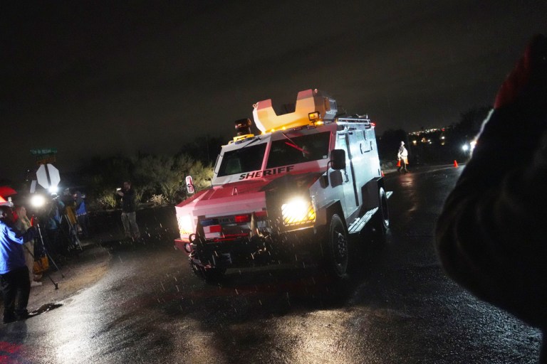 Pima County Sheriff block a road near Nancy Guthrie's home in Tucson, Ariz. on Friday, Feb. 13, 2026.