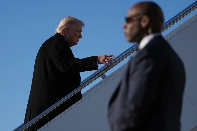 President Donald Trump boards Air Force One after speaking with reporters at Pope Army Airfield, in Fort Bragg, N.C., Friday, Feb. 13, 2026, en route to Palm Beach, Fla. (AP Photo/Matt Rourke)