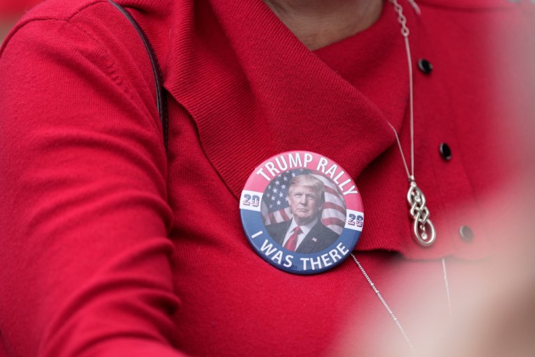 A supporter waits to see President Donald Trump.