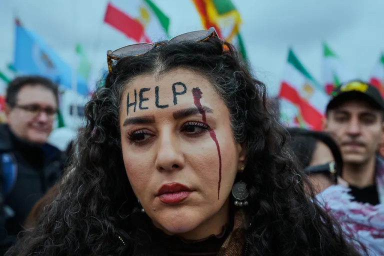 A woman participates in a demonstration in support of Iran's exiled Crown Prince Reza Pahlavi during the Munich Security Conference in Munich, Germany, Feb. 14, 2026.