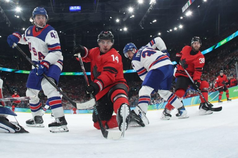 Canada's Cale Makar, not seen, scores his side's opening goal during a men's ice hockey gold medal game between Canada and the United States at the 2026 Winter Olympics, in Milan, Italy, Sunday, Feb. 22, 2026. (Bruce Bennett/Pool Photo via AP)