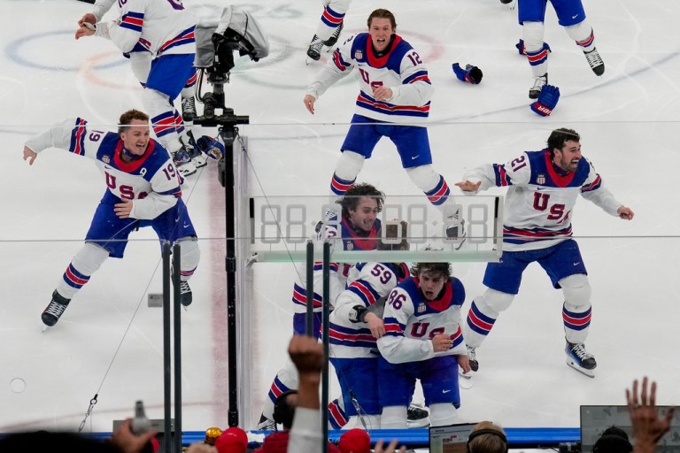 The United States celebrates after a sudden-death overtime goal by United States' Jack Hughes (86) against Canada during the men's ice hockey gold medal game at the 2026 Winter Olympics, in Milan, Italy, Sunday, Feb. 22, 2026.