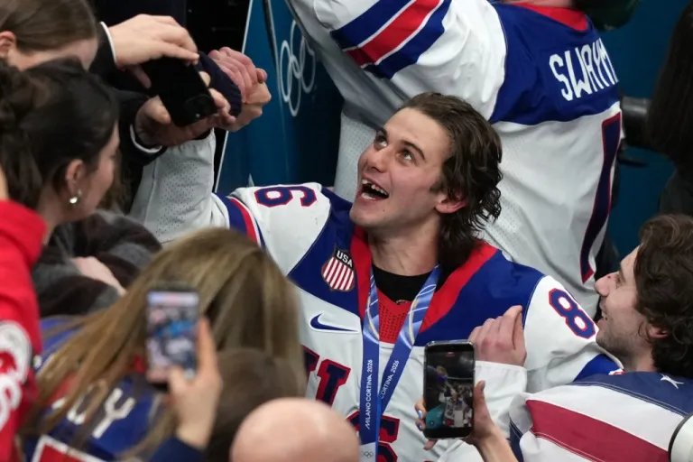 Jack Hughes (86), who scored the winning overtime goal, celebrates after defeating Canada