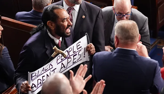 Rep. Al Green, D-Texas, is escorted out President Donald Trump delivers the State of the Union address to a joint session of Congress in the House chamber at the U.S. Capitol in Washington, Tuesday, Feb. 24, 2026, as Rep. Troy Nehls, R-Texas, watches. (AP Photo/Matt Rourke)