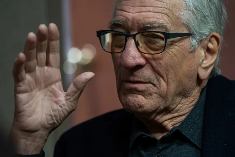 Actor Robert De Niro speaks with a reporter during a rebuttal to President Donald Trump's State of the Union hosted by Defiance.org, the Portland Frog Brigade, and COURIER, at the National Press Club, in Washington, Tuesday, Feb. 24, 2026. (AP Photo/Cliff Owen)